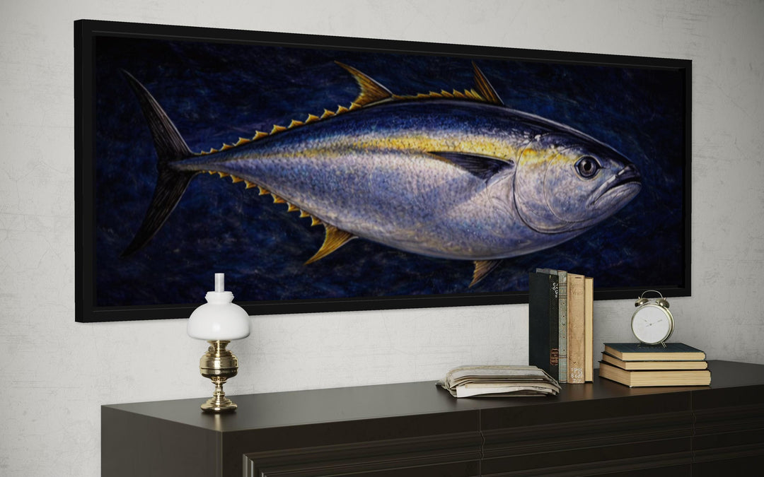 Horizontal canvas wall art of a bluefin tuna swimming in deep blue water above a dark wood console.