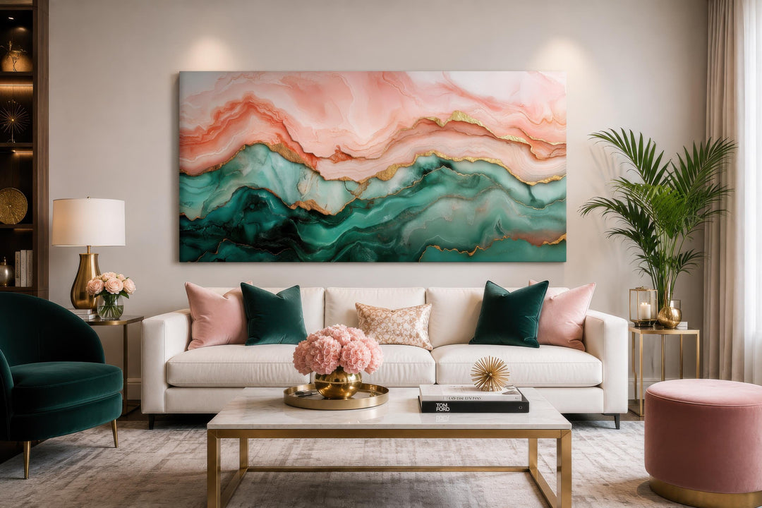 Blush pink and teal green abstract marble canvas wall art with gold veins above a white sofa.