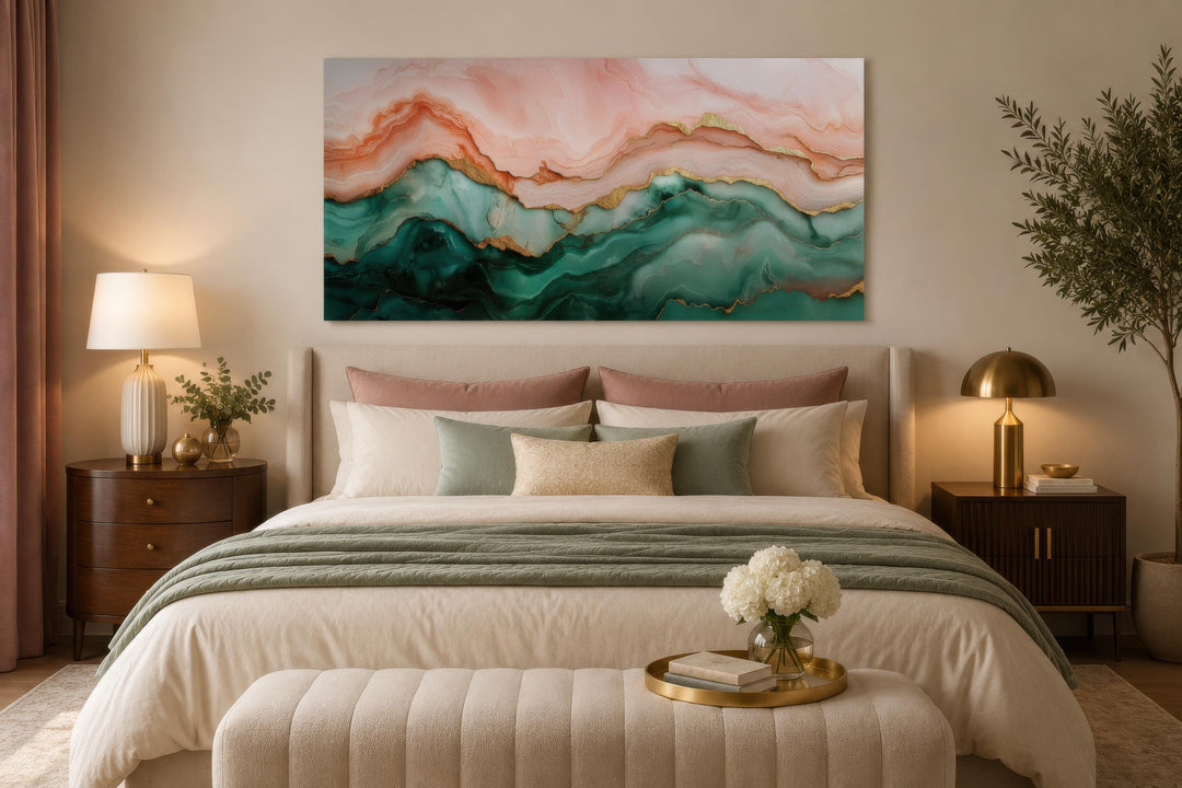 Abstract marble canvas art with blush pink, teal green, and gold veins above a bed in a bedroom.