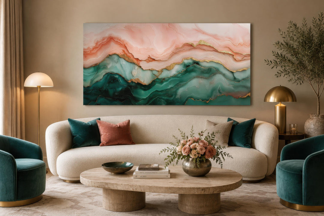 Blush pink and teal green abstract marble canvas wall art with gold veins above a cream sofa.