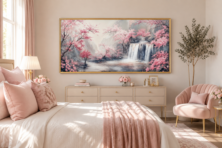 Framed canvas wall art of a grey waterfall and blush pink cherry blossoms in a serene bedroom.