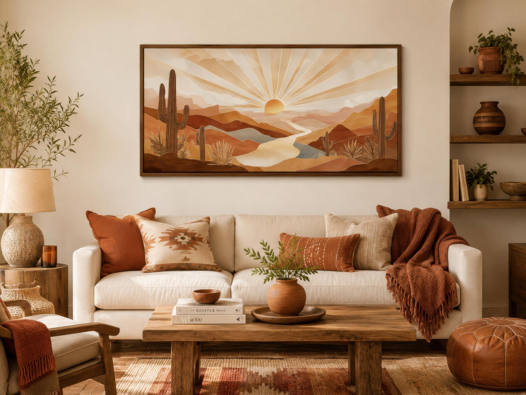 Boho desert sunset wall art featuring saguaro cacti and rolling hills in a warm, earthy living room.