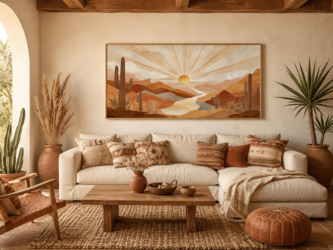 Boho desert sunset wall art featuring saguaro cacti and rolling hills in a warm living room.