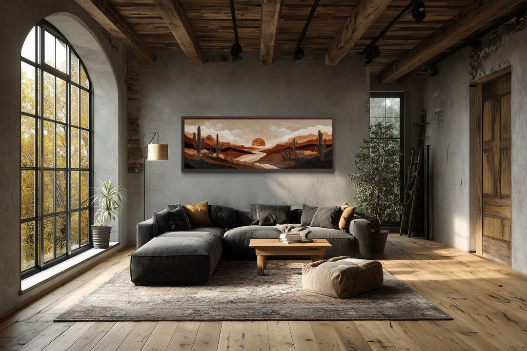 Boho desert sunset with cactus long horizontal canvas wall art in a rustic living room.