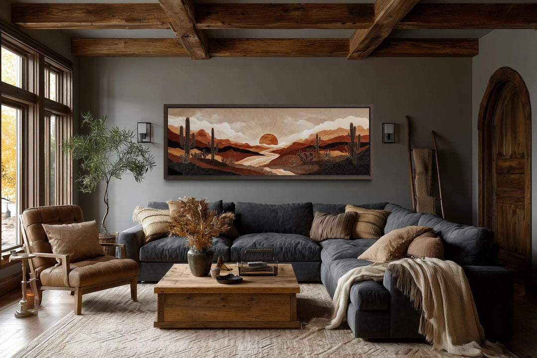 Boho desert sunset with cactus long horizontal canvas wall art in a rustic living room.