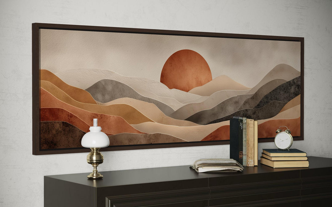 Long horizontal canvas print of a boho desert landscape with terracotta hills and a large sun.