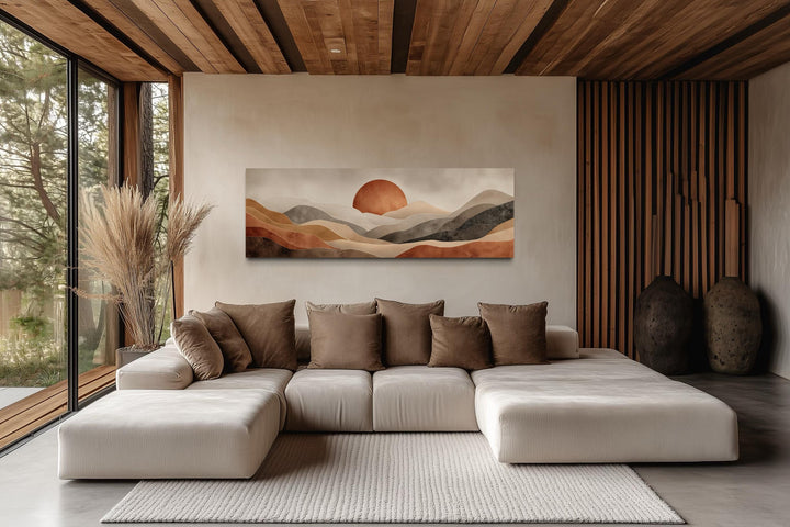 Long horizontal canvas print of a boho desert landscape with a terracotta sun over rolling hills.
