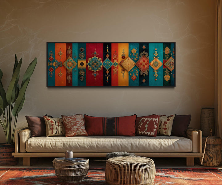 Boho Moroccan long horizontal colorful geometric wall art above a sofa in a warm living room.