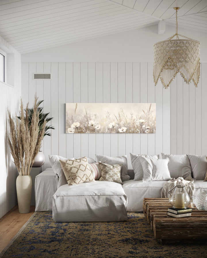 Horizontal canvas wall art of neutral wildflowers in a boho farmhouse living room.