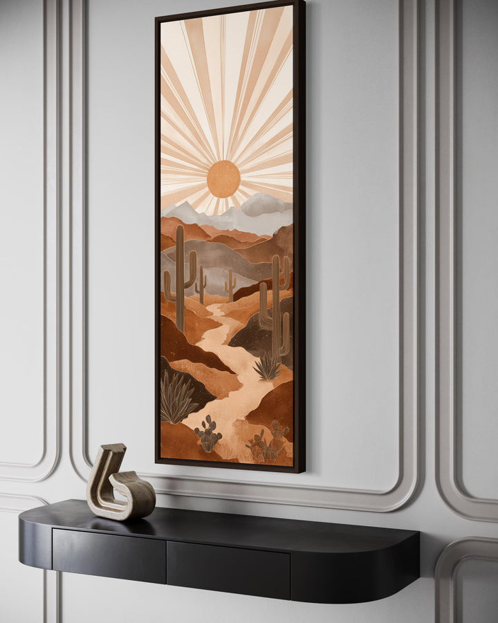 Tall narrow canvas art of a boho desert landscape with saguaro cacti and a radiating sun.