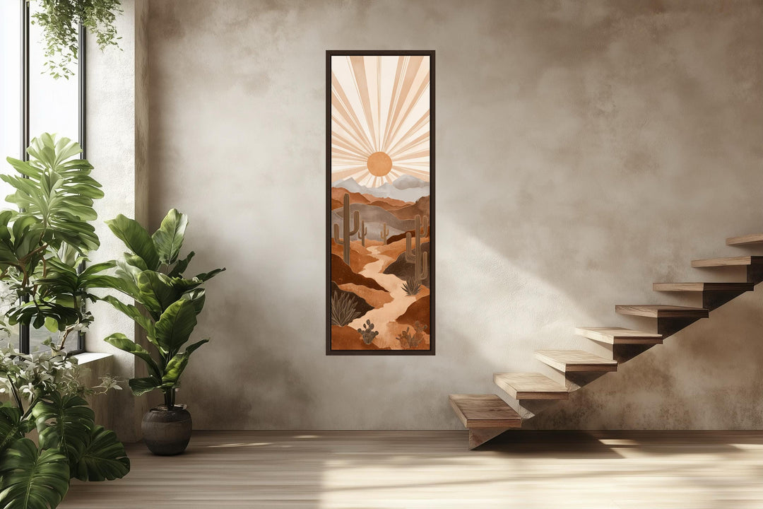 Tall narrow canvas art featuring a boho desert landscape with saguaro cacti and a radiating sun.