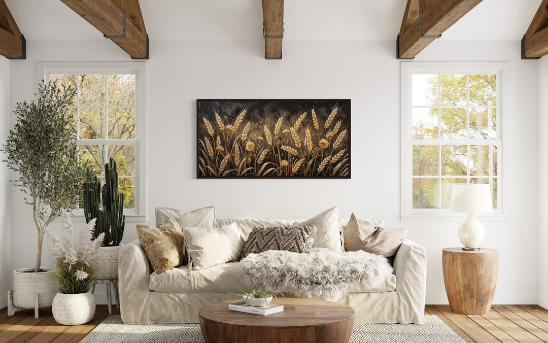Boho wheat field framed canvas print in a rustic living room with neutral decor and wooden beams.