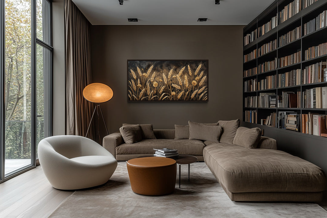 Framed horizontal canvas print of a golden wheat field in a modern brown living room.
