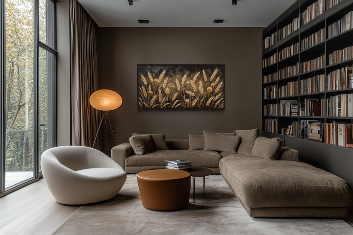 Framed horizontal canvas print of a golden wheat field in a modern brown living room.