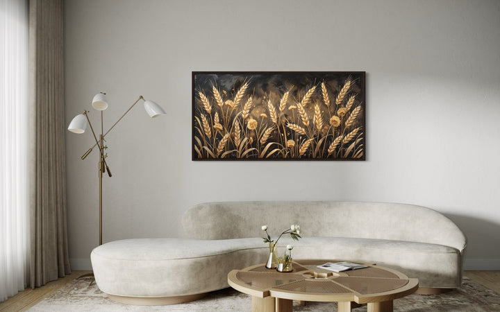 Framed horizontal canvas print of a golden wheat field in a modern living room setting.