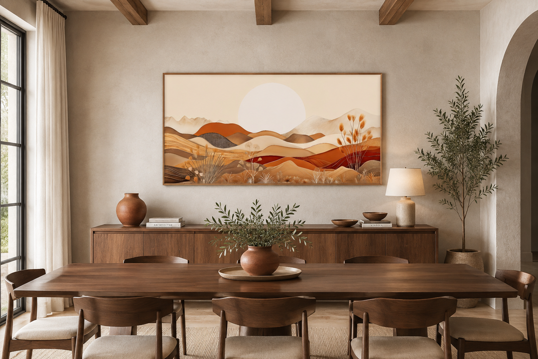 Boho desert landscape framed canvas wall art in neutral earth tones above a wooden sideboard.