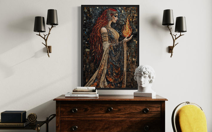 Brigid Celtic Goddess mosaic painting canvas wall art above a wooden dresser with a bust and lamps.