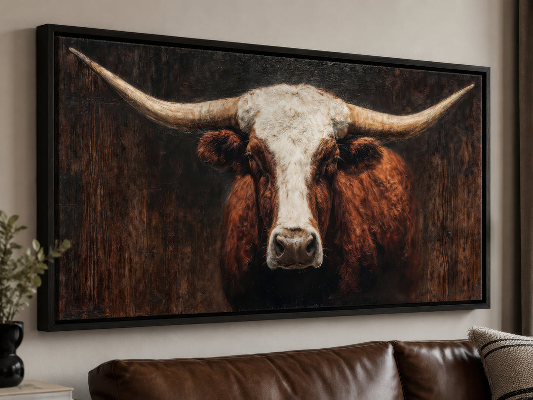 Extra large canvas wall art featuring a brown and white Texas longhorn bull in a black frame.