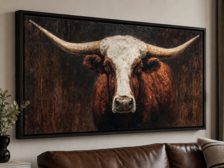 Extra large canvas wall art featuring a brown and white Texas longhorn bull in a black frame.
