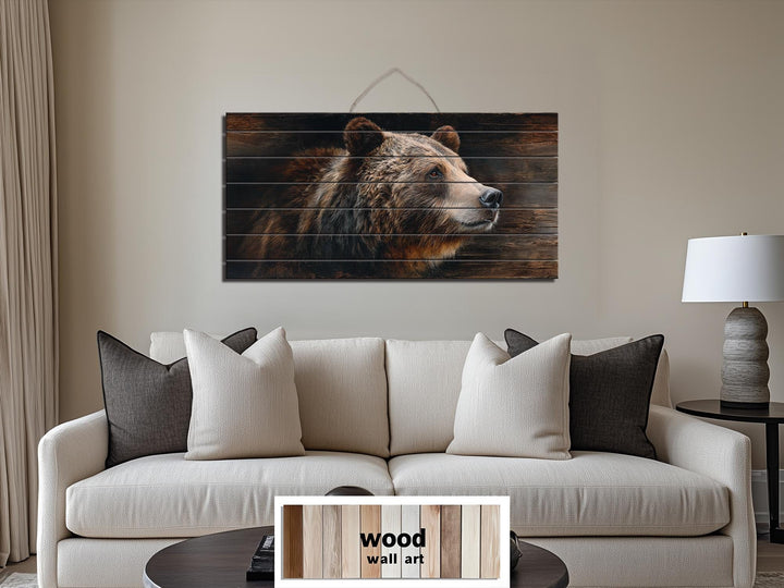 Large horizontal wood wall art featuring a detailed brown bear portrait above a modern sofa.