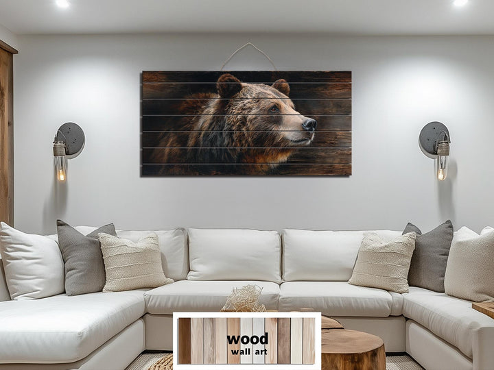 Large horizontal wood wall art featuring a detailed brown bear portrait above a white sectional sofa.
