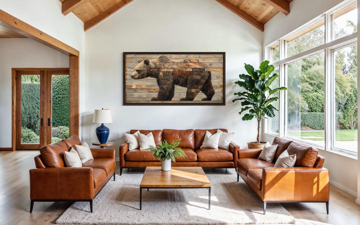 Rustic brown bear wall art on a wood-style canvas hanging in a modern cabin living room.