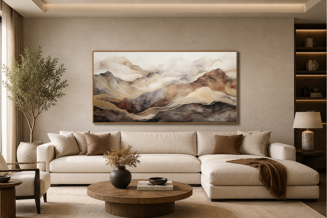 Brown and beige abstract marble mountain framed canvas wall art above a neutral sofa.