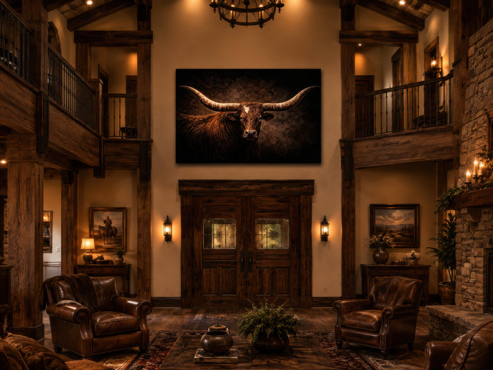 Brown longhorn bull canvas wall art centered above double doors in a rustic western living room.