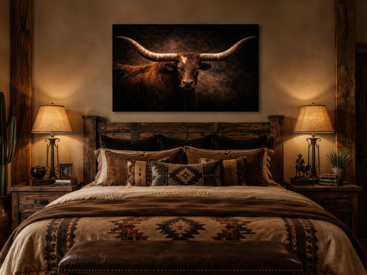 Brown longhorn bull canvas wall art hanging above a rustic wooden bed in a western-style bedroom.
