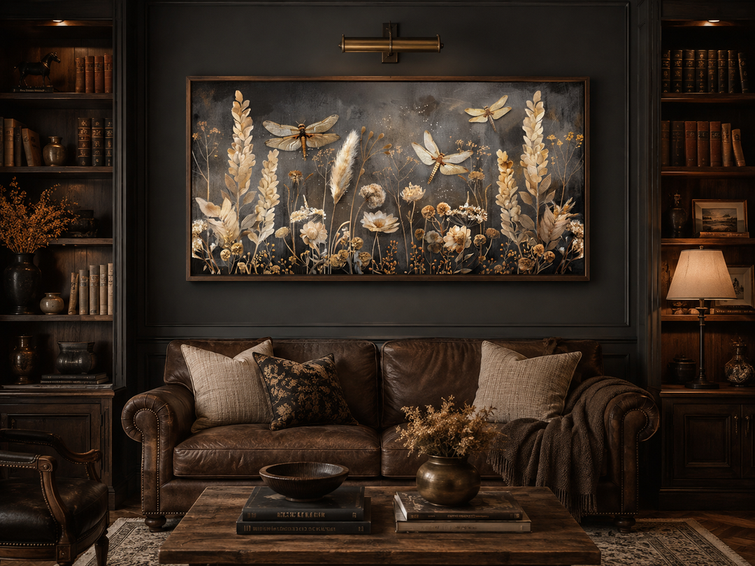 Boho wall art featuring brown and beige grass with dragonflies on a framed canvas above a sofa.