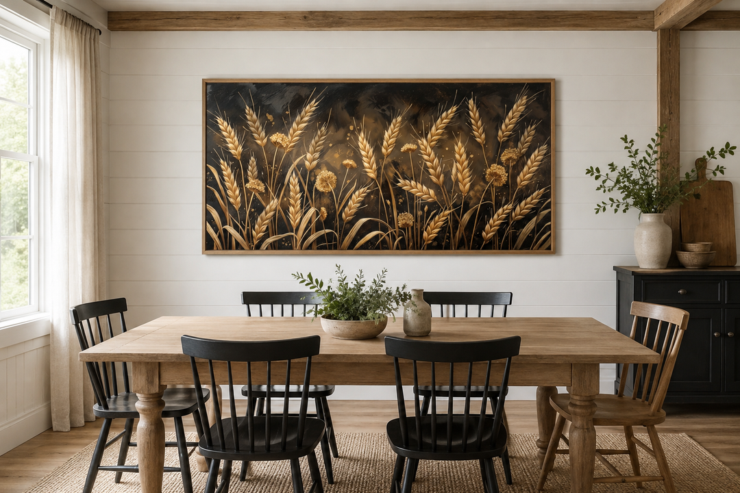 Boho wheat field framed canvas print in a rustic dining room with a wooden table and black chairs.
