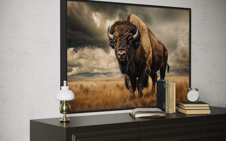 Buffalo in the wild framed canvas wall art in sepia tones above a dark wood dresser.