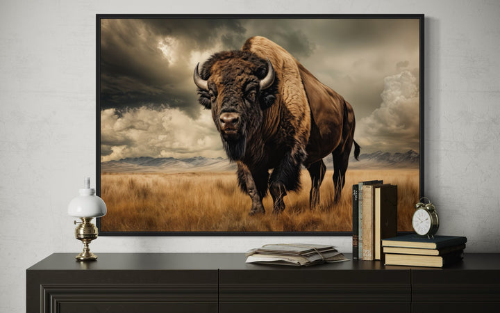 Buffalo in the wild framed canvas wall art in sepia tones above a dark wood dresser.