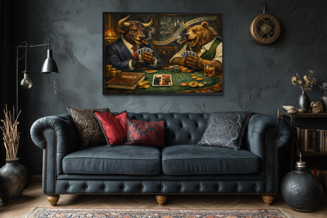 Bull and bear poker game canvas print hanging above a dark tufted sofa in a moody, modern room.