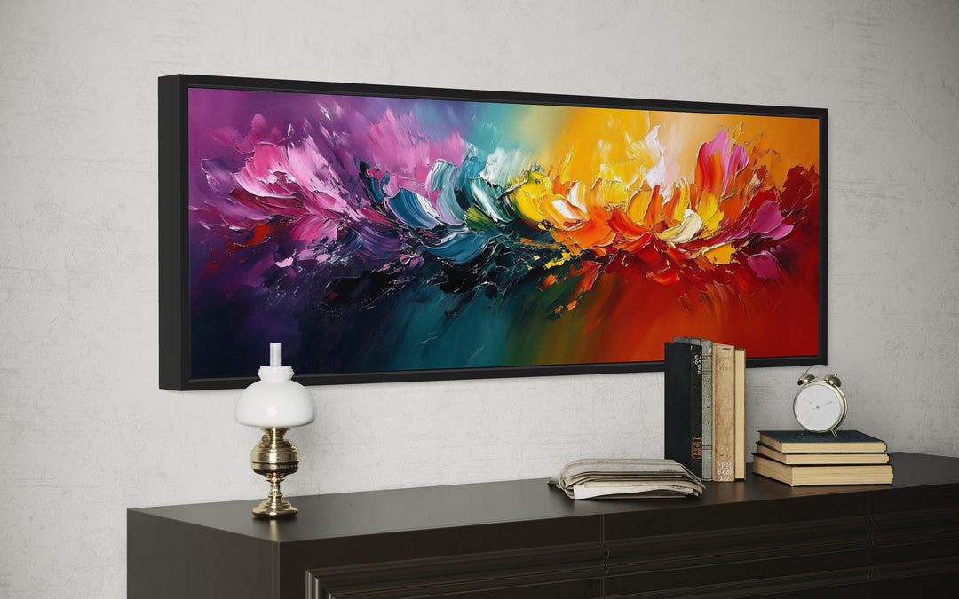 Long horizontal rainbow canvas wall art with vibrant abstract brushstrokes in a black frame.