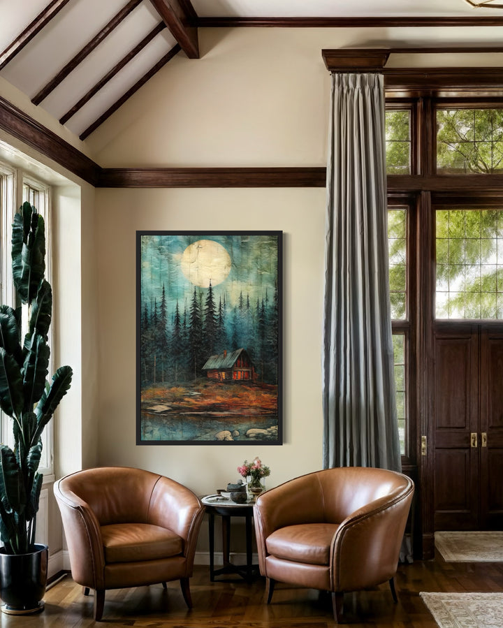 Cabin In The Woods Framed Canvas Wall Art hanging above two leather armchairs in a rustic room.