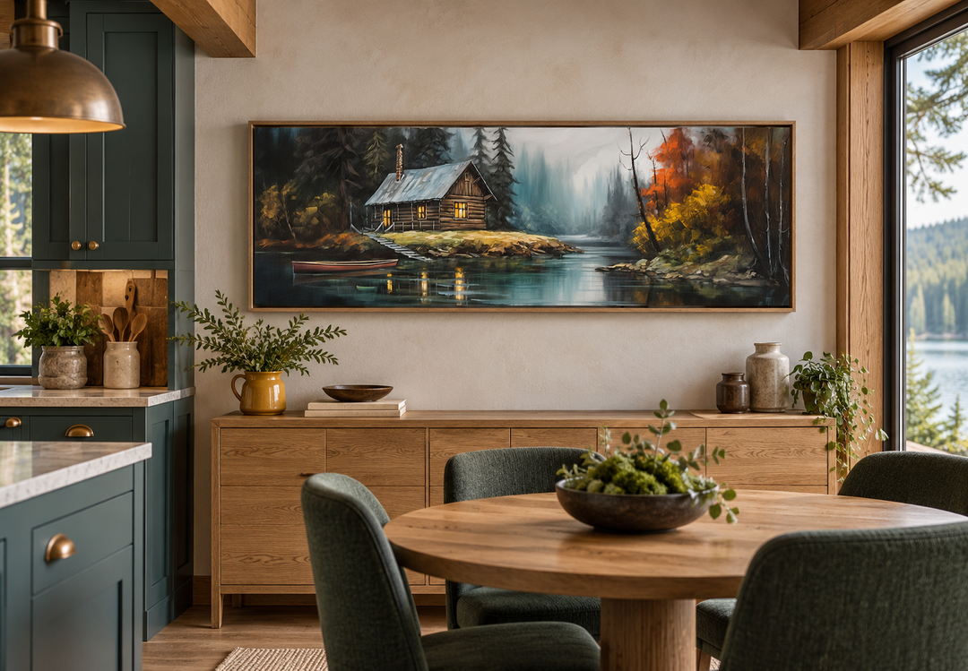 Narrow rustic framed canvas wall art of a cabin on a lake, displayed in a dining room.