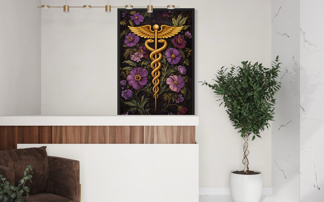 Caduceus medical wall art featuring a golden symbol amidst purple flowers in a modern office.