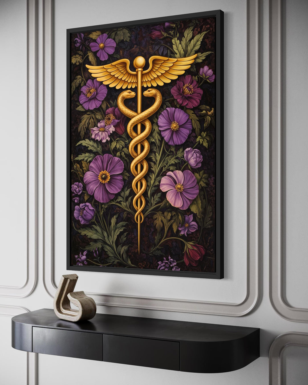 A framed canvas print of a golden caduceus symbol surrounded by vibrant purple and pink flowers.