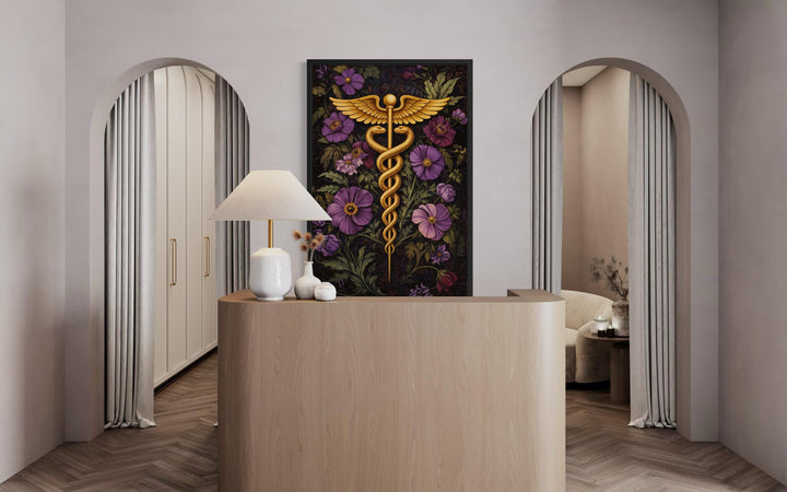 medical office wall decor - A vertical canvas print of a golden caduceus symbol surrounded by purple flowers in a modern office.