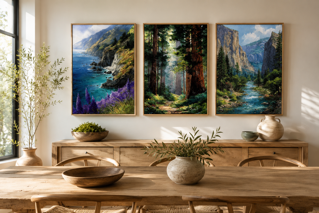 Set of 3 framed California landscape paintings of Big Sur, Redwood Forest, and Yosemite on a wall.