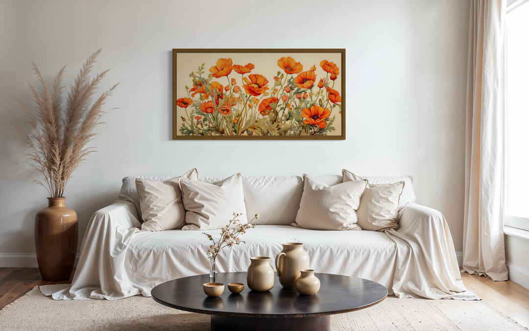 California Poppies Framed Canvas Wall Art hanging above a white sofa in a neutral living room.