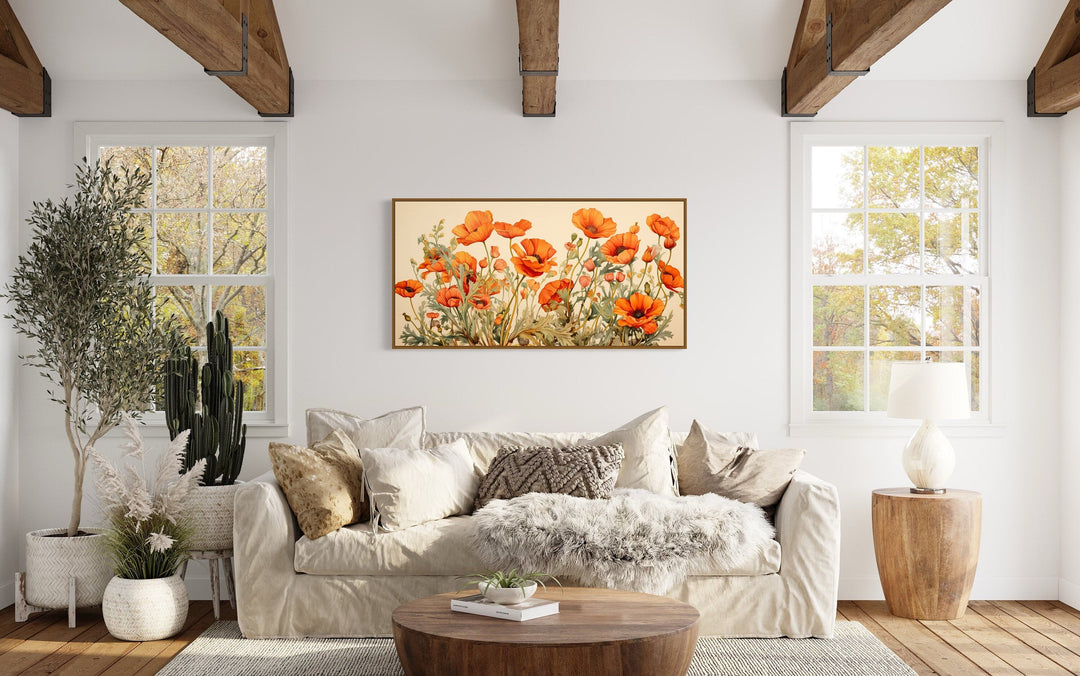 California Poppies Framed Canvas Wall Art featuring orange blooms above a neutral sofa.