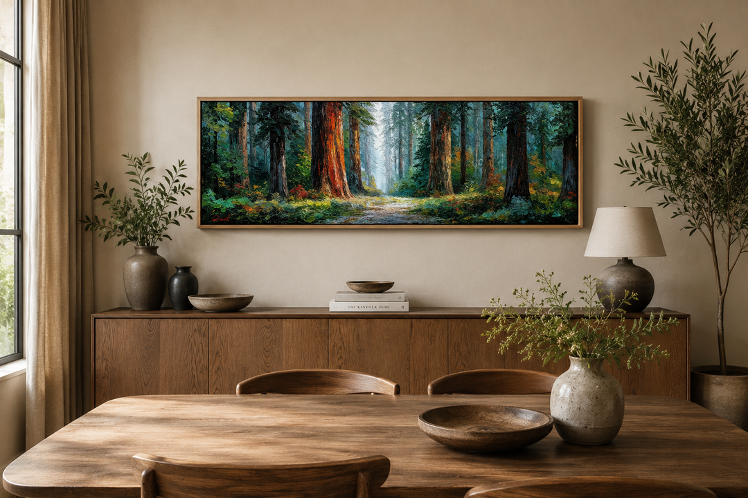 Long horizontal canvas art of a California redwood forest above a wooden sideboard in a dining room