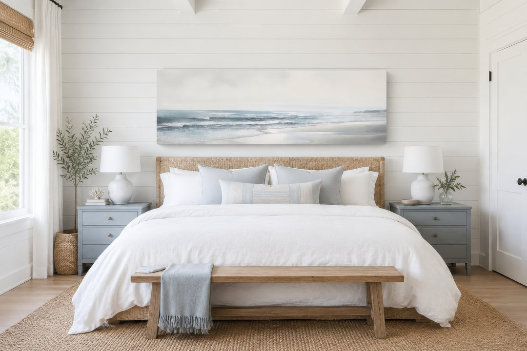 Long horizontal framed canvas wall art featuring a minimalist coastal beach scene in soft blues.