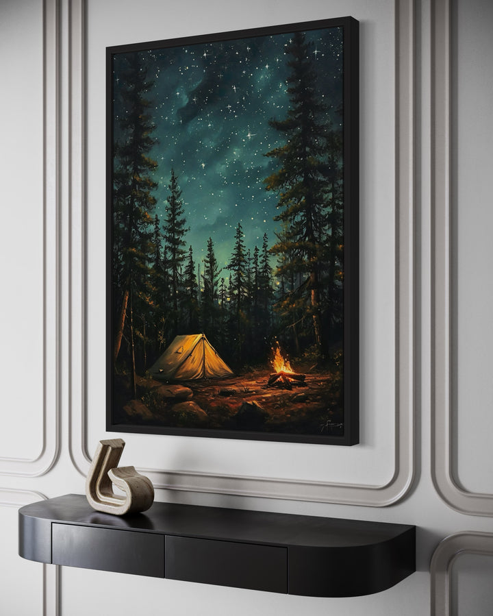 Framed canvas art of a glowing campfire and tent in a pine forest under a starry night sky.