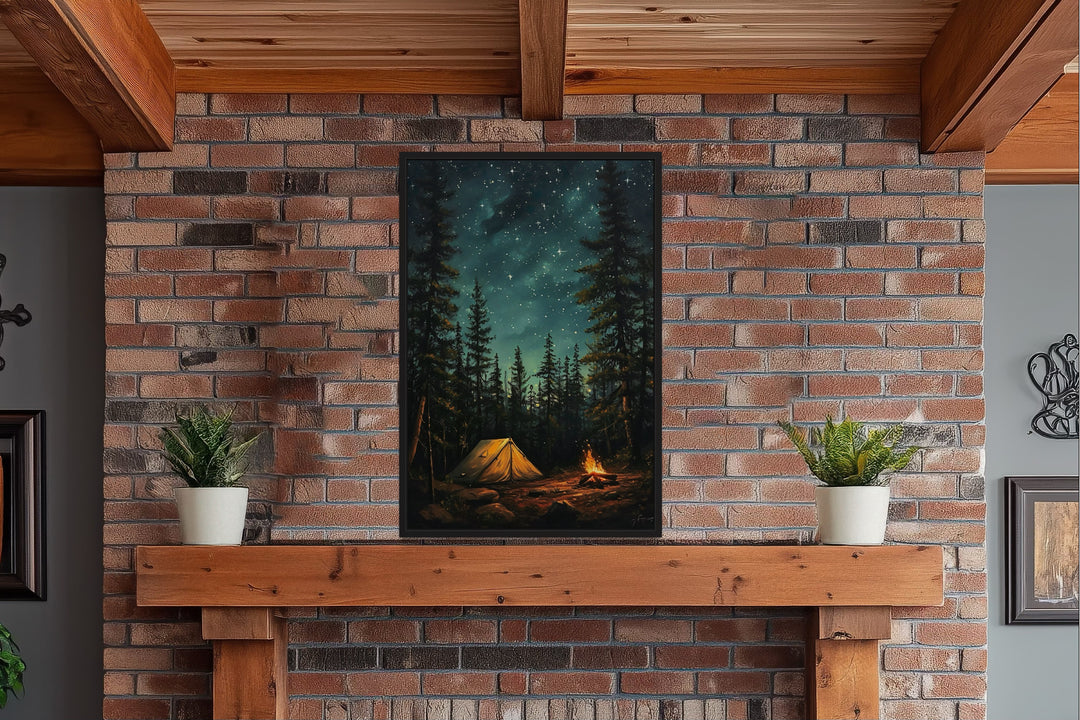 Campfire and tent in a pine forest under a starry night sky, framed wall art on a brick fireplace.