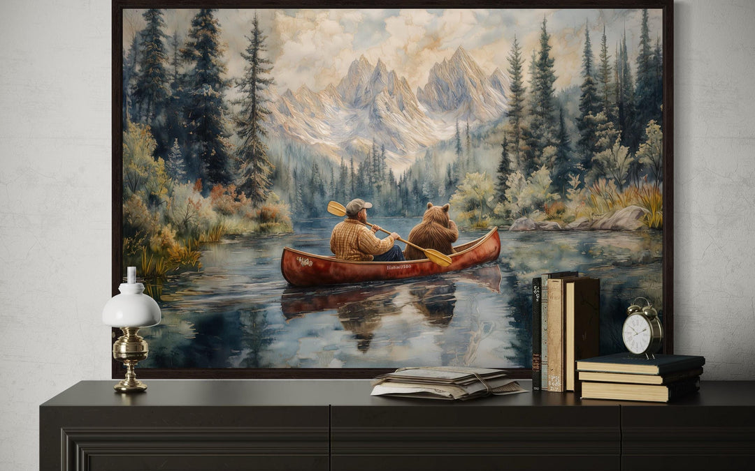 Man and bear in canoe on mountain lake wall art.