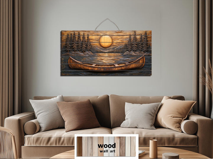 Canoe in the lake at sunset wood wall art hanging above a sofa in a rustic living room.