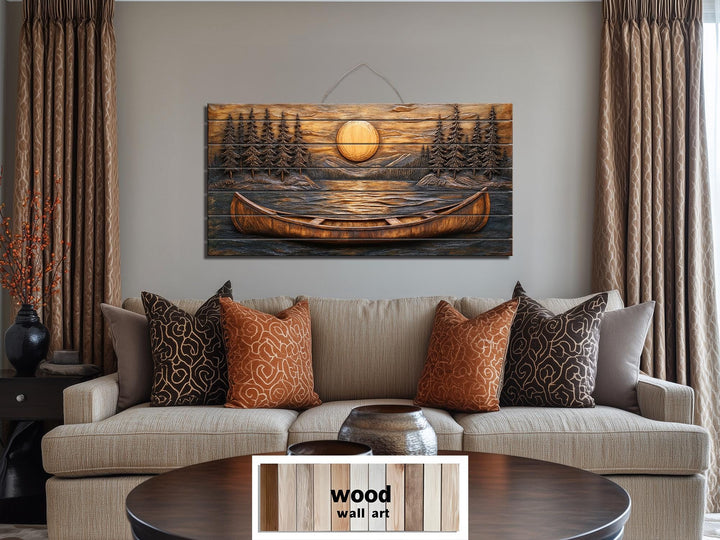Canoe in the lake at sunset wood wall art displayed above a sofa in a rustic living room.